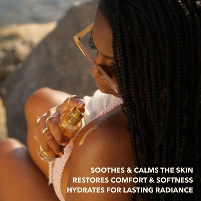 Woman applying soothing and calming shimmering body oil to shoulder to restore comfort and hydration