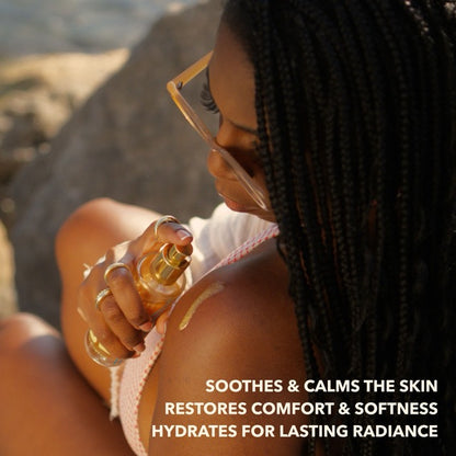 Woman applying soothing and calming shimmering body oil to shoulder to restore comfort and hydration
