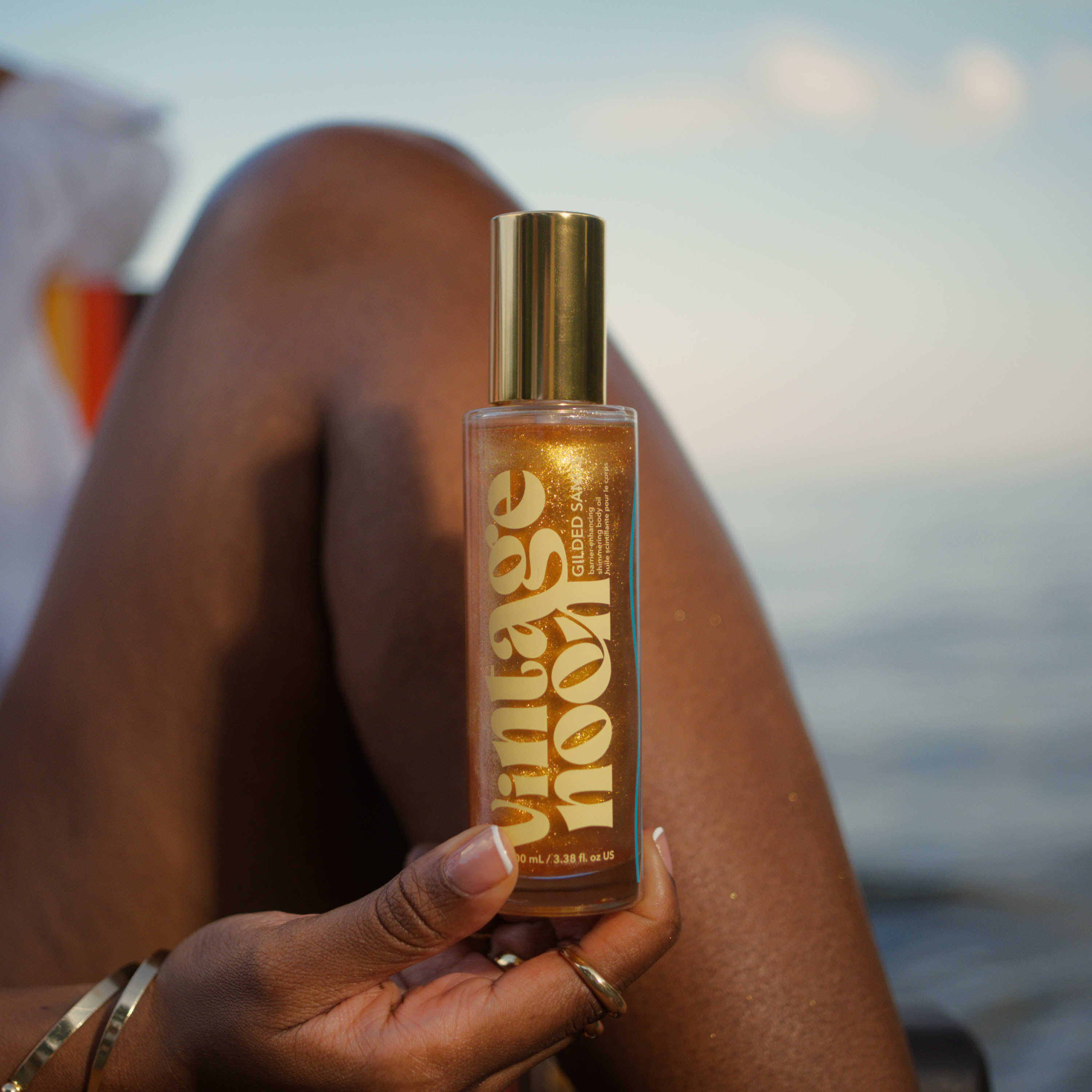 shimmering body oil on dark skintones