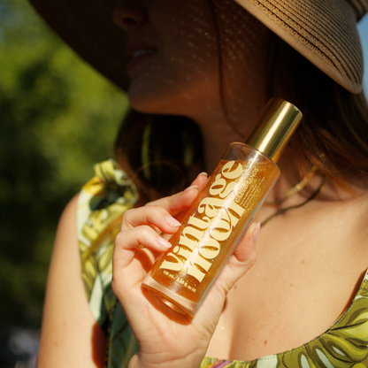 Woman holding a bottle of &